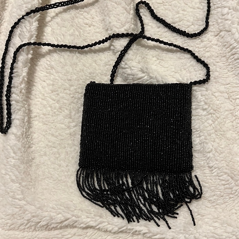 Neiman Marcus purse great condition color black with beads